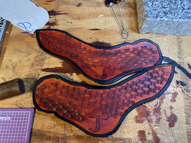 a custom tooled spur strap 